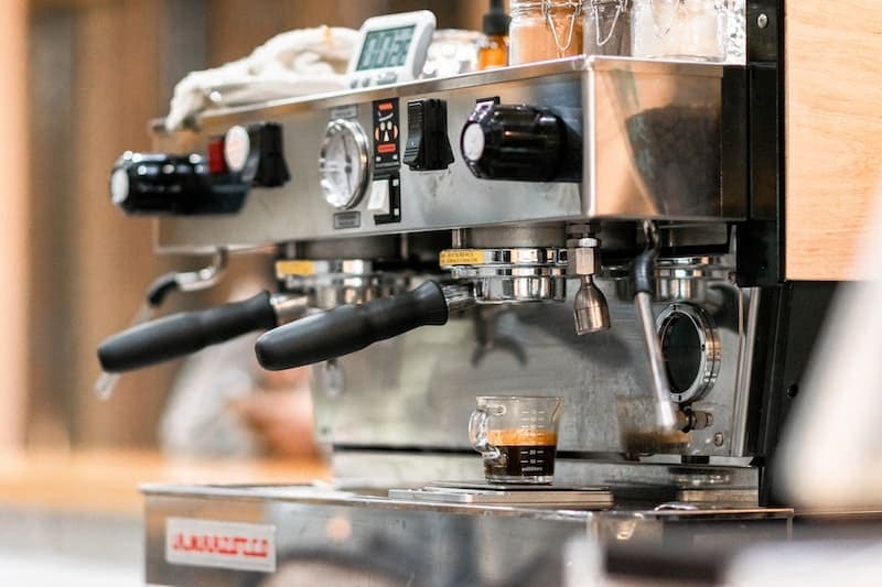 used espresso machine pulling a shot