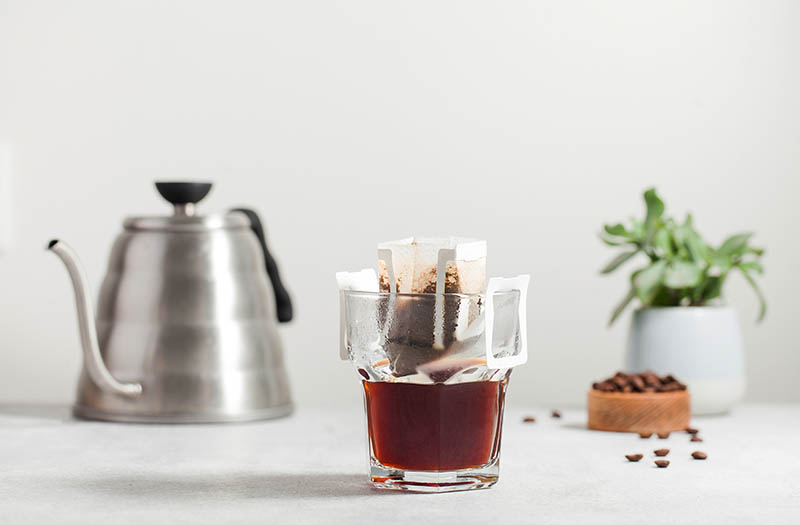 Drip coffee bag in a glass