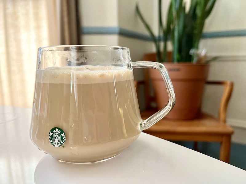 Starbucks hot pistachio latte in glass on table
