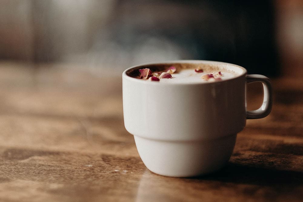 a cup of rose latte