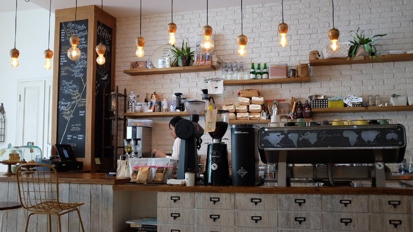 barista making coffee in a coffee shop