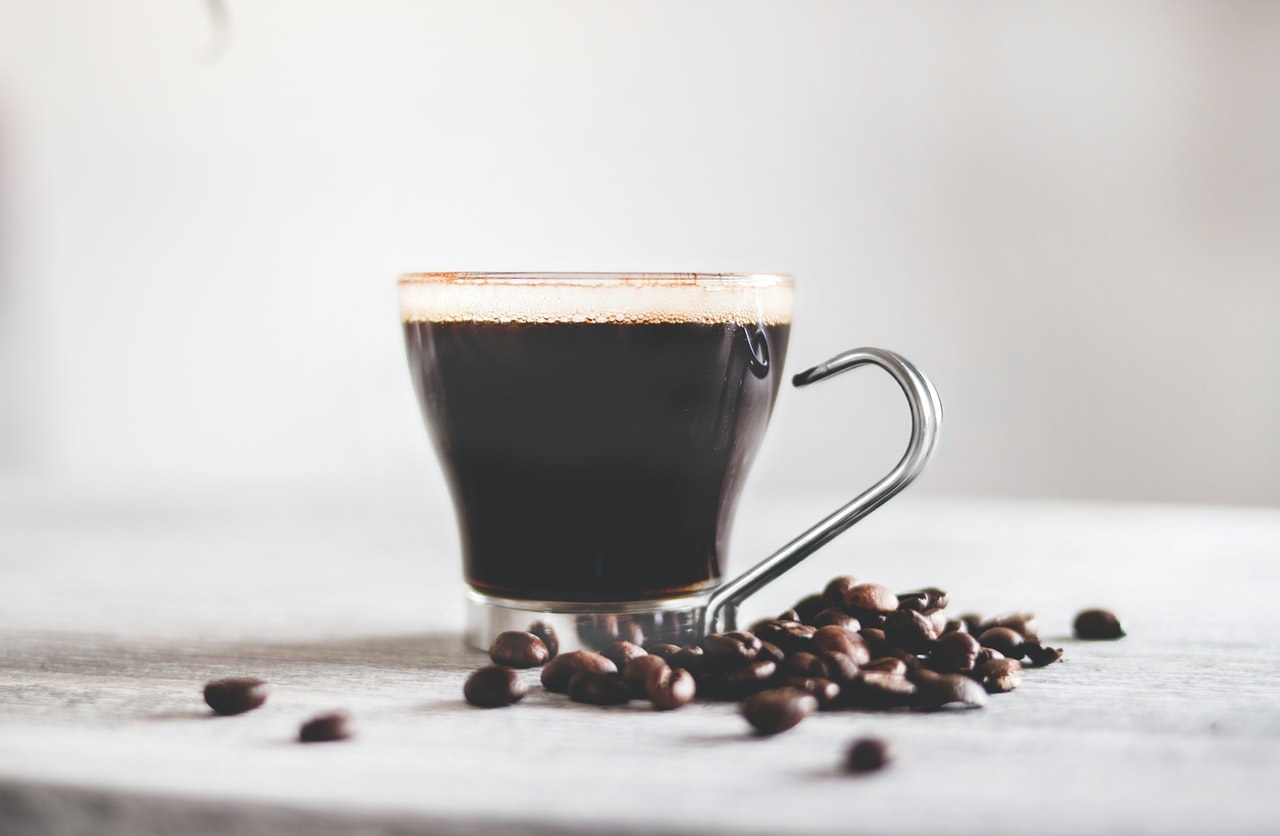 cup of coffee and coffee beans