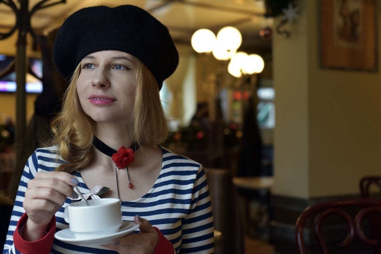 french woman having a cup of coffee