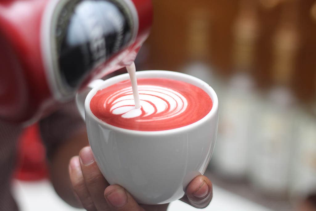 pouring milk on Red Velvet Latte