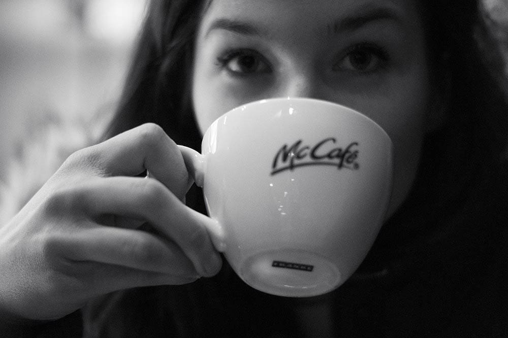 woman drinking mccafe coffee