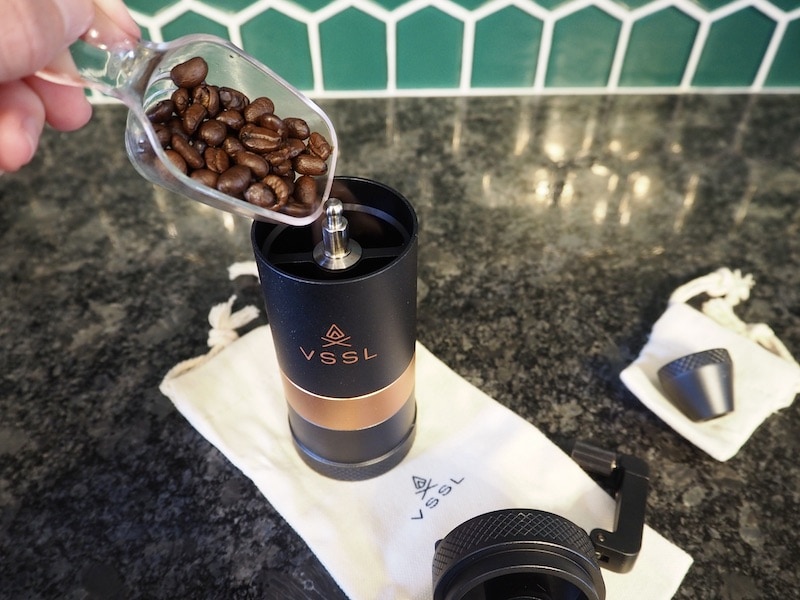 Adding fresh coffee beans to VSSL Java grinder