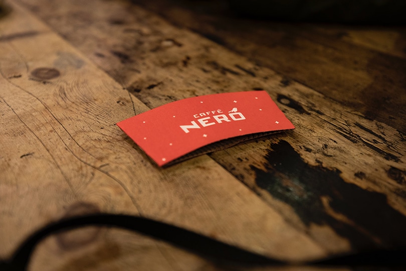 a red java jacket on wooden surface