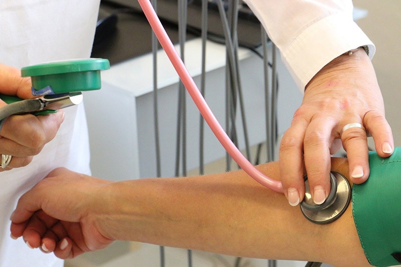 doctor getting blood pressure of a patient