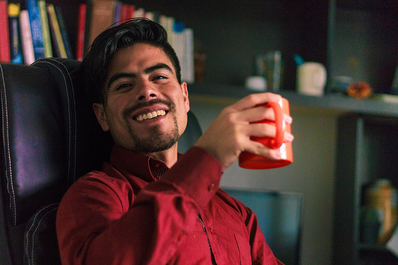 man enjoying his cup of coffee