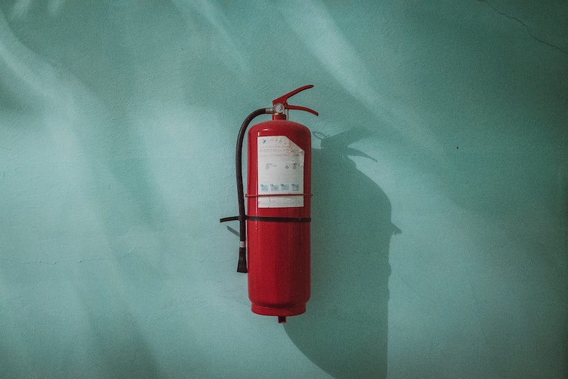 fire extinguisher hanging on wall