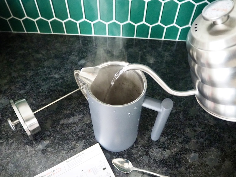 gooseneck kettle pouring hot water into BW French press