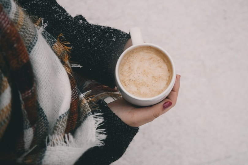 woman holding a mug of coffee