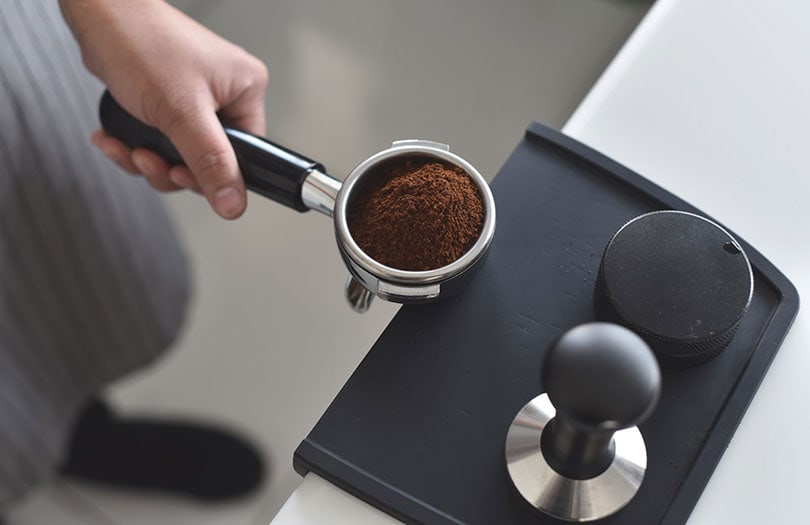a person preparing coffee