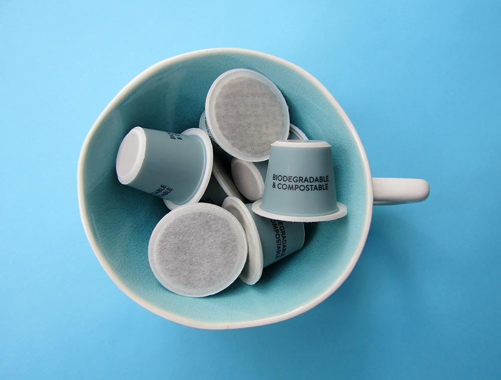 cup of compostable coffee pods