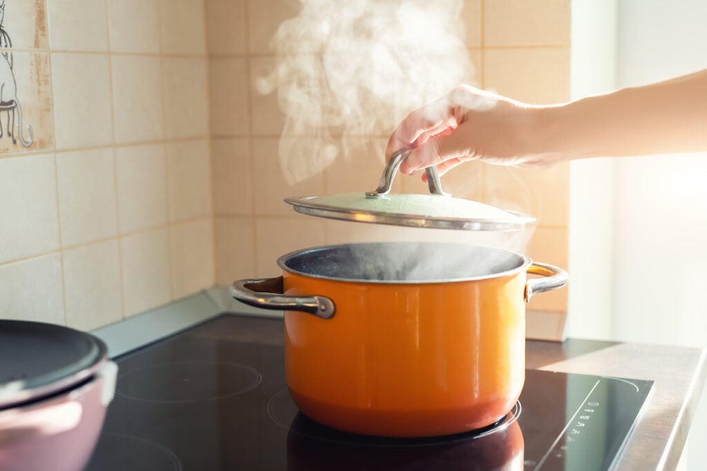 Putting lid on pot