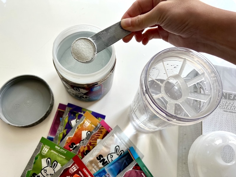 preparing Sneak Blue Raspberry drink in shaker