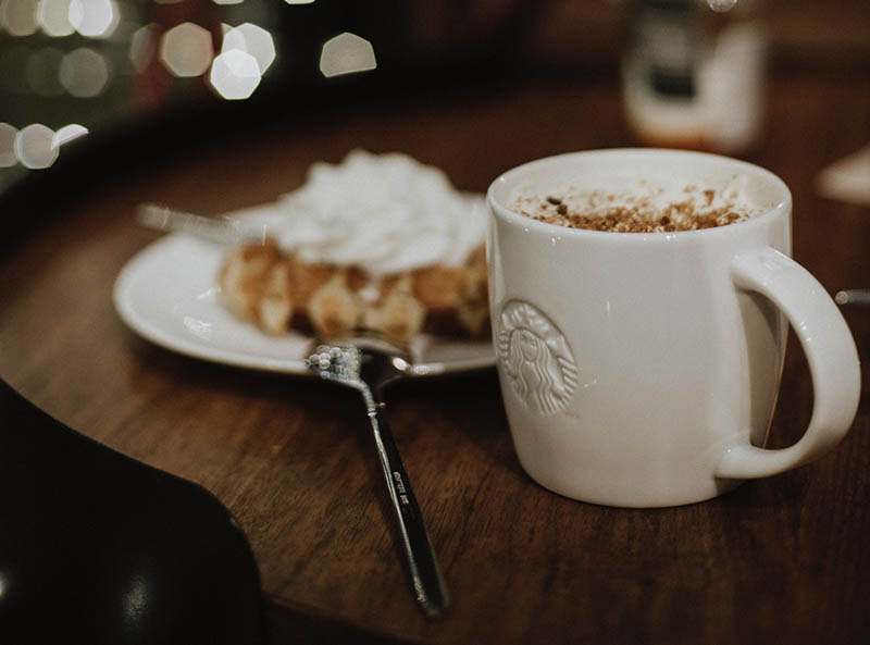 a cup of Starbucks hot chocolate and waffle