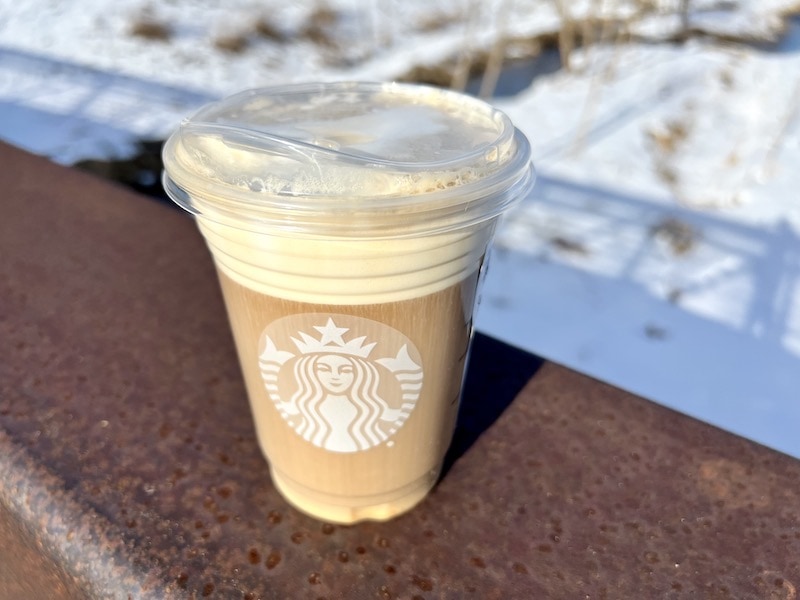 Starbucks cold brew with sweet vanilla cold foam in plastic cup