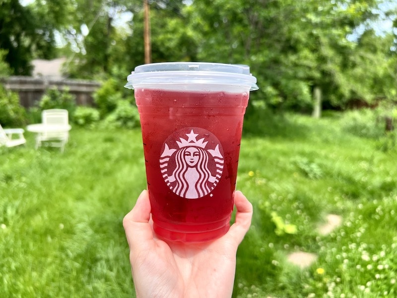 Starbucks passion iced tea drink outside