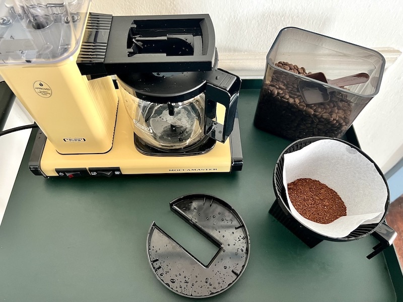 freshly ground coffee in Moccamaster filter and brew basket