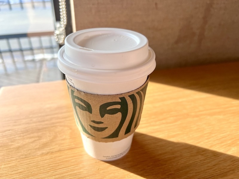 Starbucks hot drink coffee cup on table inside cafe_Kate