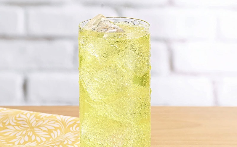a glass of sun drop soda