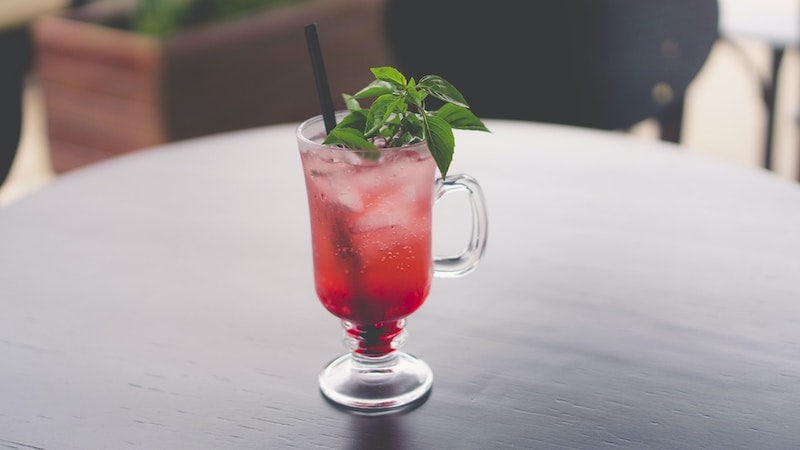 italian soda in a glass with basil