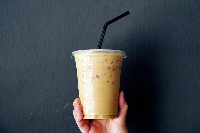 woman hands holding iced coffee
