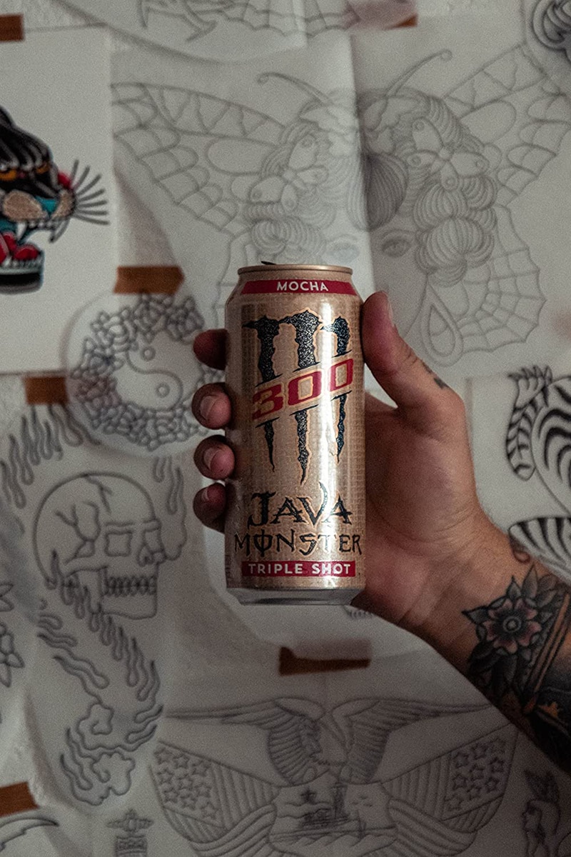 hand holding Monster Energy Java 300 Triple Shot Robust Coffee + Cream