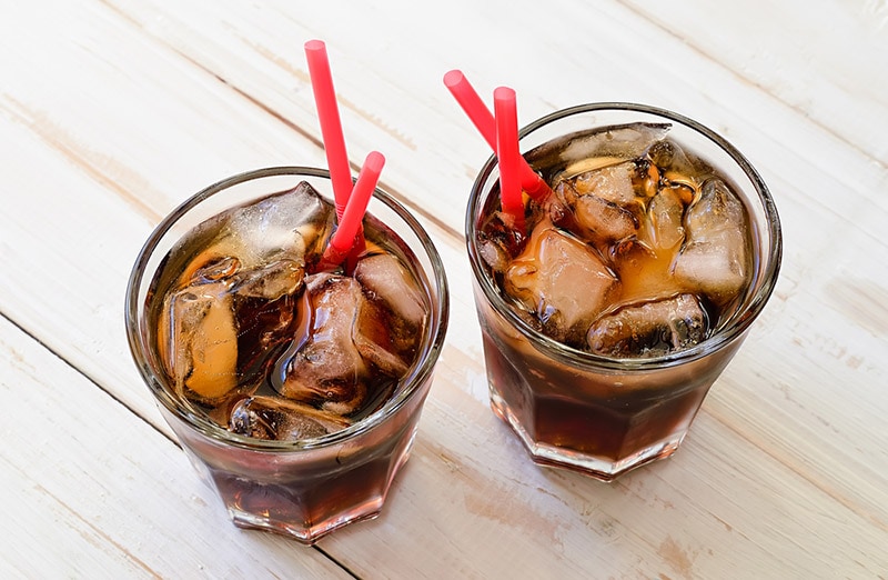 two glasses of cold soda
